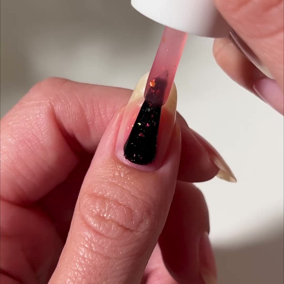 video of lava lamp nail polish being painted on fingernails